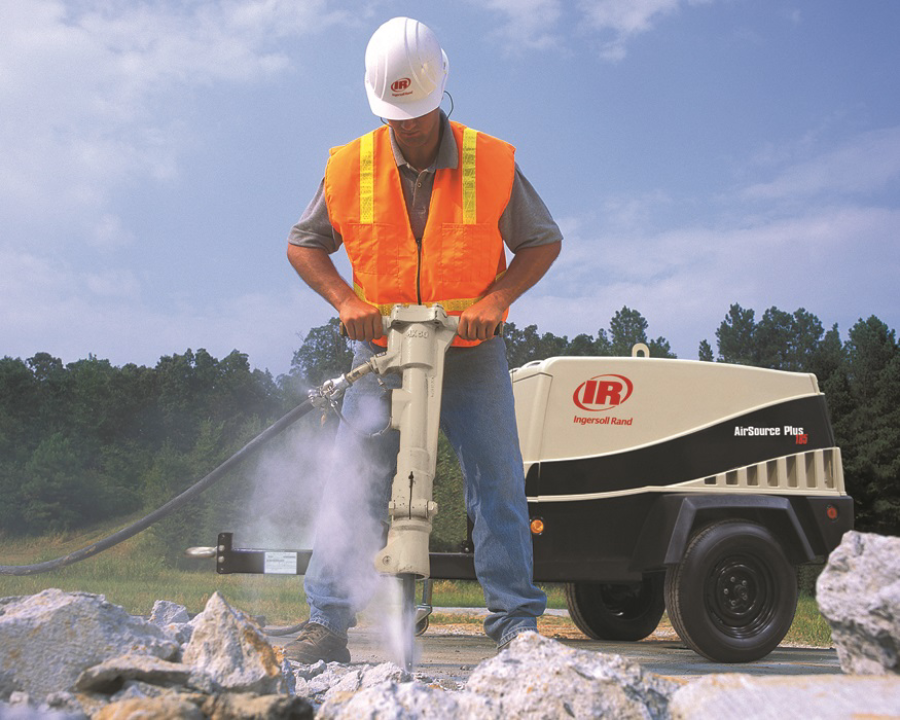 Photo of a worker using a jackhammer