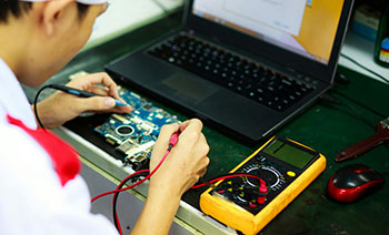 Picture depicting a man doing electronics