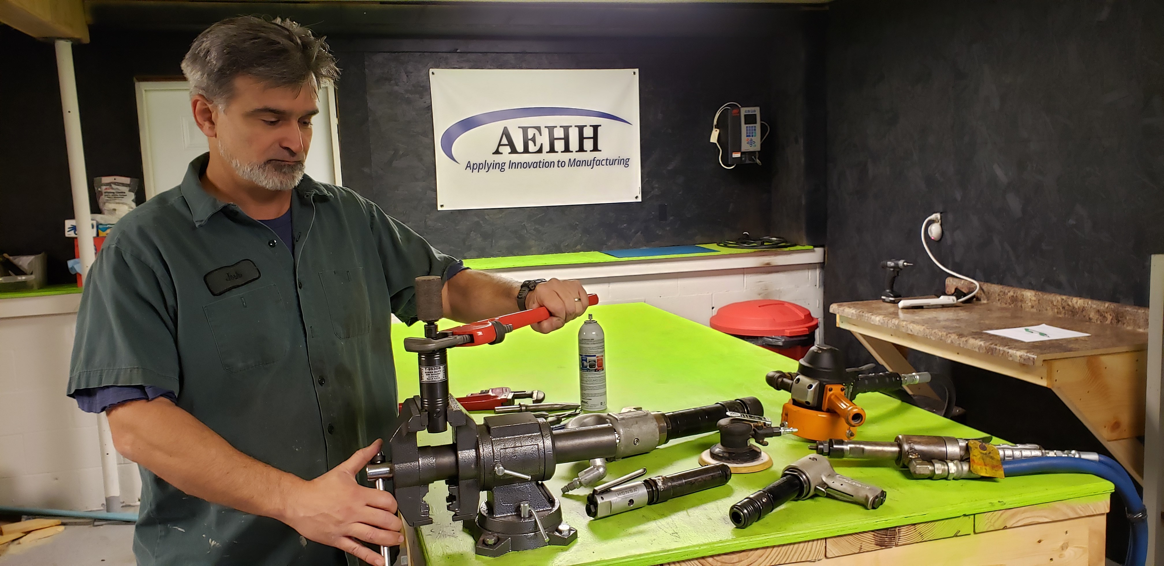 Picture of a worker repairing a power tool