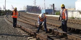 Picture depicting construction workers on a railway