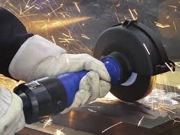 Photo of a worker's hands using a turbine grinder